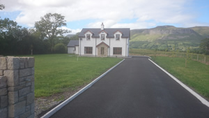 Front elevation with gate post, new build construction, private house in Rathcormack, County Sligo